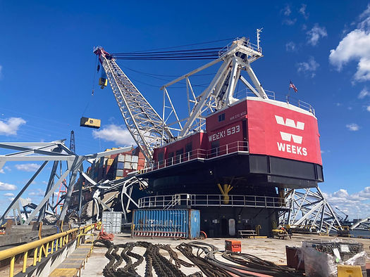 Response crews began removing shipping containers using a floating crane barge at the site of the Francis Scott Key Bridge on April 7, 2024