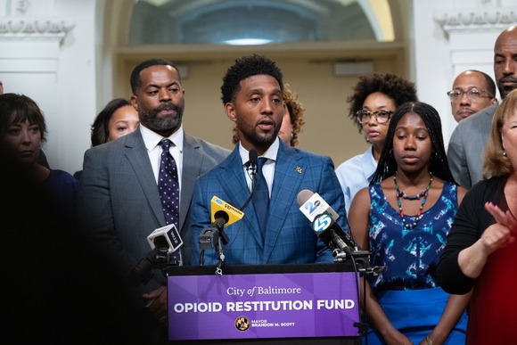 Mayor Scott Announces Opioid Restitution Fund surrounded by elected leaders and partners