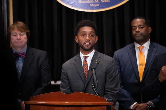 Mayor Scott speaks at press conference introducing TIF legislation, next to City Council President Nick Mosby and Housing Commissioner Alice Kennedy.