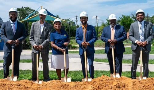 Mayor Brandon M. Scott with group of people with shovels standing near freshly turned soil.