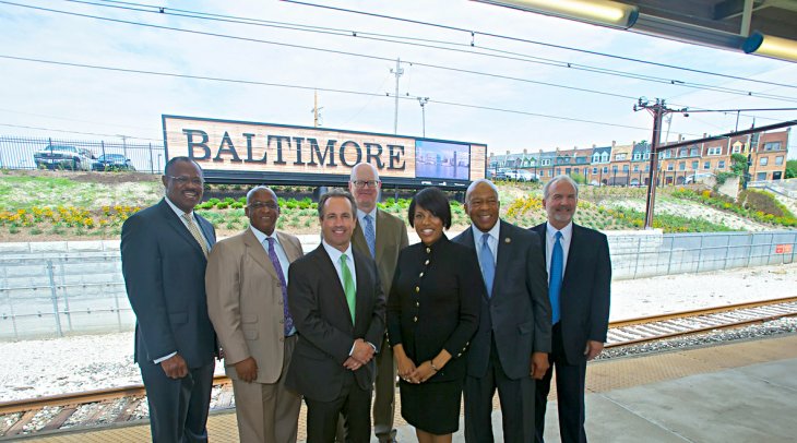 IMAGE: Mayor Rawlings-Blake and a number of City and State officials unveil a new welcome sign at Penn Station